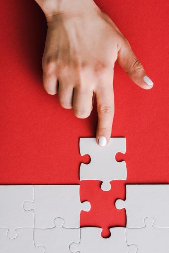 top-view-of-woman-pointing-with-finger-at-jigsaw-n-U5QPV3E-1.jpg